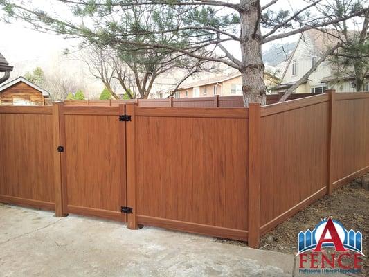 A Fence Utah. Mocha Walnut Vinyl Fence.