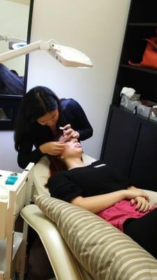 Resident Esthetician working magic!