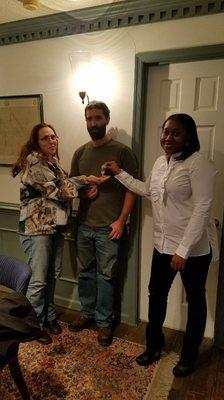 The Greers gladly accepting the keys to their new home.