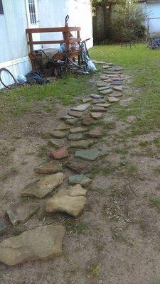 stone walkway job #2 not allowed to beak ground or add sand and boarders around the walkway so it is and remains in finished until notice