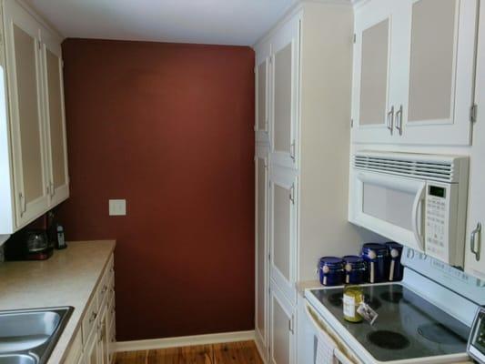 Repainted the cwiling, walls, and enameled the cabinets