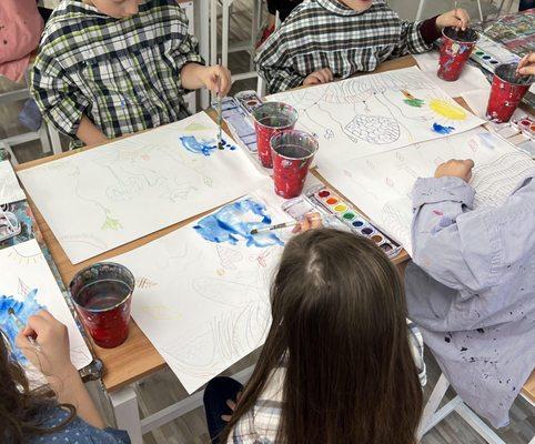 Students learning watercolor techniques during Spring Break Camp!