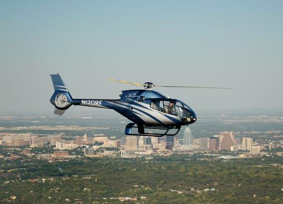 Cannon Aviation Group, Inc., President Scott Cannon flying a Eurocopter over the Austin skyline.