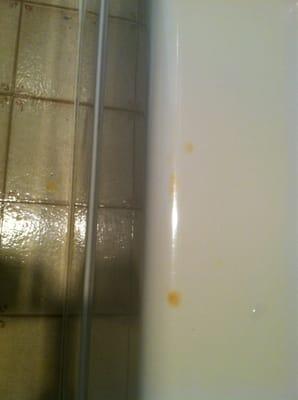 Cigarette burns on the bathtub? Do people really smoke and pee at the same time?