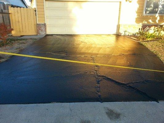 Hot rubber crack field in slurry sealed on concrete driveway#4