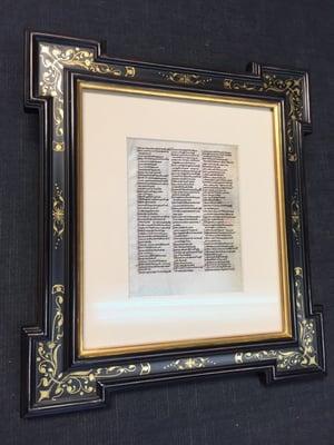 Small very old Bible page framed in sgraffito panel, pyramid corner hand crafted frame