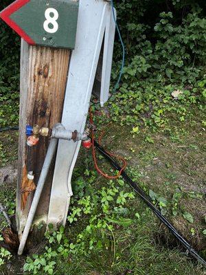 Electrical up close & personal with a dripping water spout.