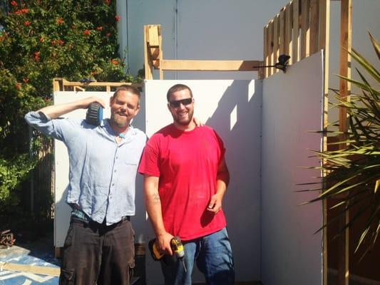 Mikel and Jared preparing demo walls for an American Clay workshop at Green Goods