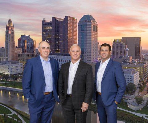 NRS Injury Law partners Dave Nager, Dan Romaine and Jerry Schneiberg with Columbus skyline image.   Visit our Columbus Office