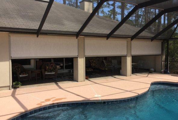 Power retractable screens with solar fabric