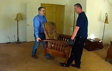 Our team moving furniture prior to cleaning carpets.