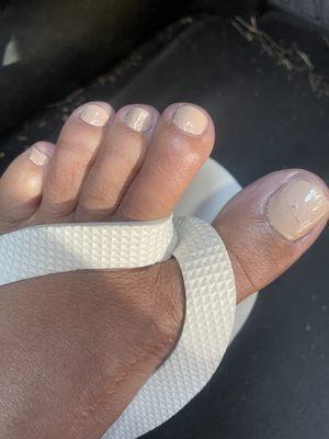 Big toe has hair or clothes fiber stuck in paint