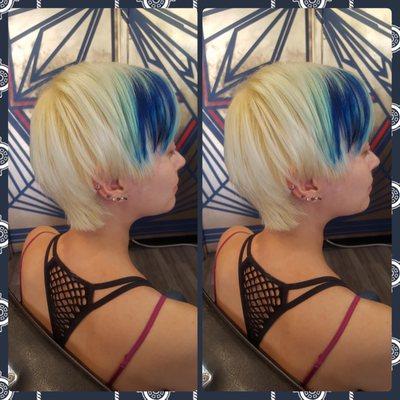 Hair bleached and with blue streek, short light textured haircut.