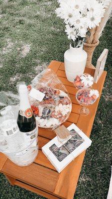 customize your picnic by adding some chocolate covered berries or a charcuterie box.