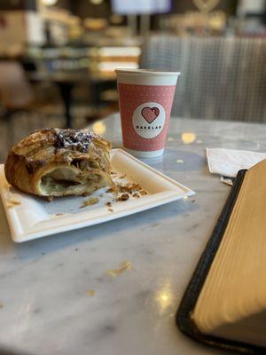 Seating, lychee and pistachio croissant, cup