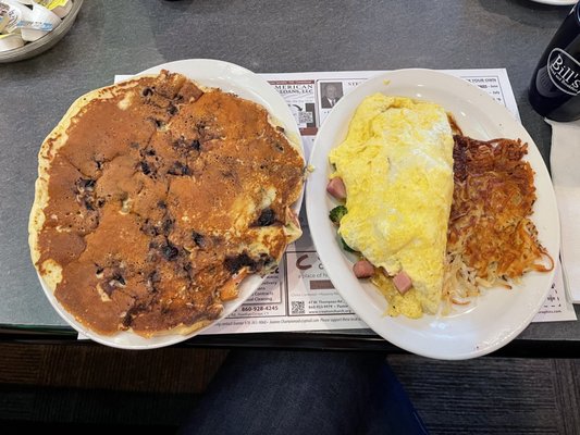 Blueberry pancake, omelette with ham, broccoli and cheddar, side of home fries.