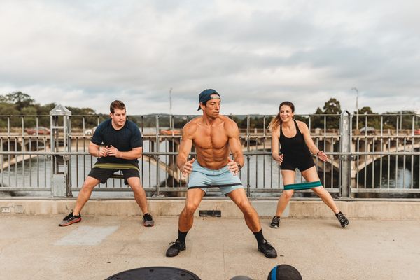 Personal trainer, Eric Champ leading a small group.