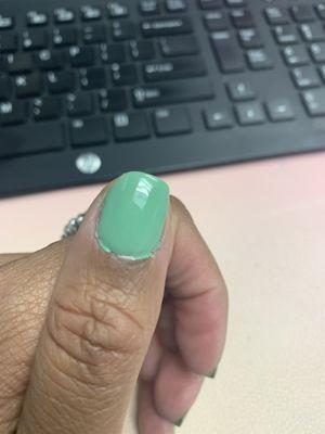 Polish and material clumped around cuticle