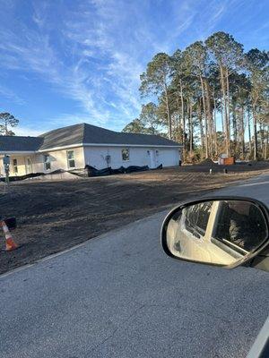 18 in French drain installed and covered up with swale to collect storm water