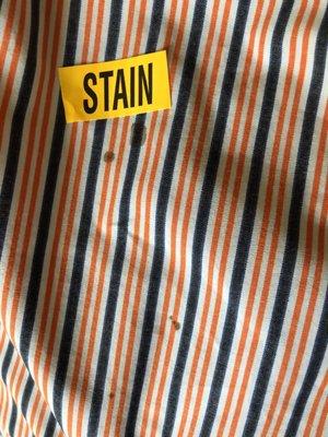 Black stains on shirts returned by cleaners