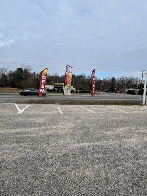 Banners, welcoming people into the parking lot of the restaurant.