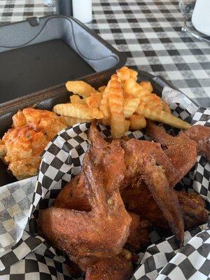 Wings, fries, and potato salad.