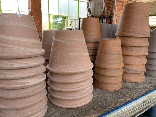 Terra cotta pots with a twist.  We love the new swirl design.