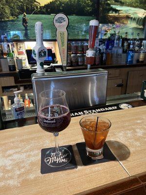 Drinks at the bar: raspberry sour beer on tap & a Brandy old fashioned