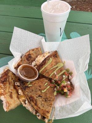 A huge steak quesadilla with homemade salsa.