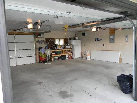 Just one of the two heated garages with poured concrete flooring and automatic overhead doors.  4 bays in all...