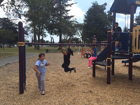 Having fun on the monkey bars.