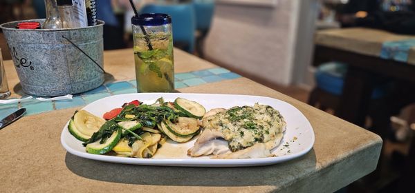 Pineapple mojito and baked crab grouper