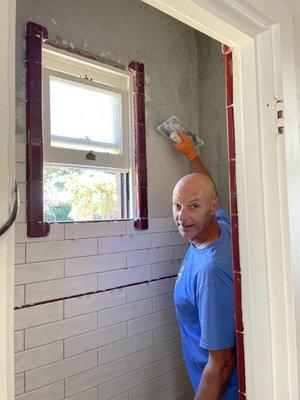 Tom floating the wall and installing subways & vintage Healy tiles.