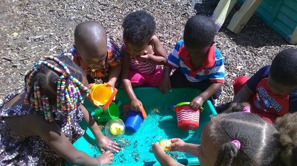 Children playing at the water table.