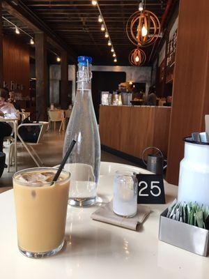 View of the cafe, ample seating with natural light.