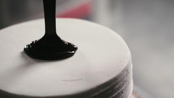 Blulight Films San Diego Video Production company filming a close up of a cake being made.