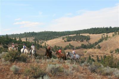 A summer camp trail ride on the edge of Rock Creek Canyon.