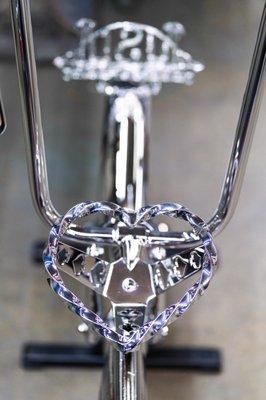 Chrome steering wheel for lowrider bike.