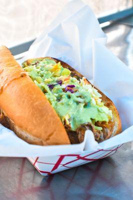 Pulled Pork Sandwich - Cherry Cola braised pulled pork, island apple coleslaw, creamy tomatillo dressing served on a toasted hoagie roll