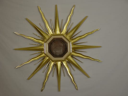 sunburst frame water gilded in 22kt gold leaf with eglomise mirror