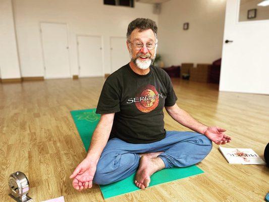 Gentle Yoga & Breath and Meditation teacher Jamie in sukhasana, easy seat!