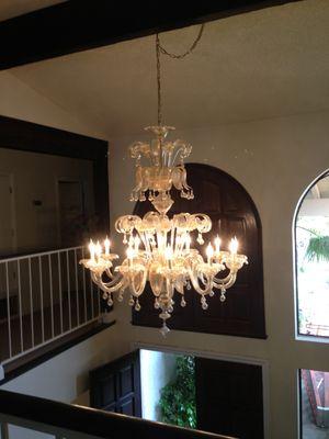 Chic chandelier assembled and installed