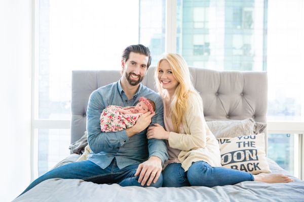 lifestyle at home session with a casually wrapped and cozy newborn