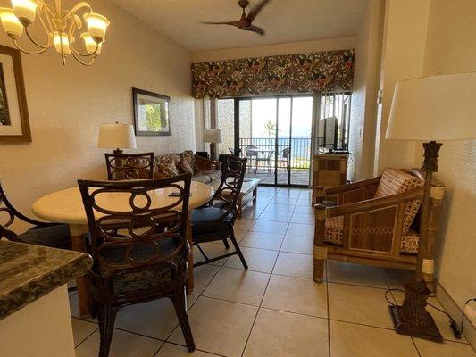 Dining table and living room. Very narrow unit