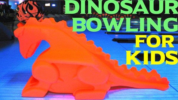 Dinosaur Bowling For Kids.
 Red Glow in the Dark Dinosaur Ramp with Glow in the Dark Fire Bowling Ball on Glow in the Dark approaches...