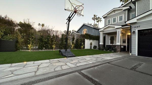 Concrete Driveway, Flagstone Pathway, Lighting, Planting Artificial Turf & Herbs Garden by Lush Gardens, Inc. In Valley Village California