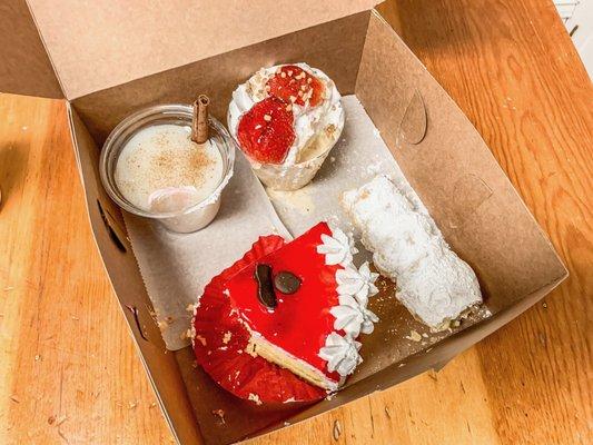 tres leches, vanilla cake, a cup of what tasted like horchata with a jello/pudding texture, cork screw shaped pastry filled w/bavarian cream