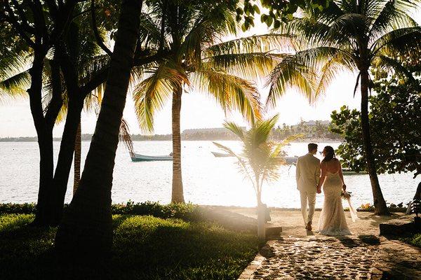 Newlyweds at sunset in Akumal, Mexico