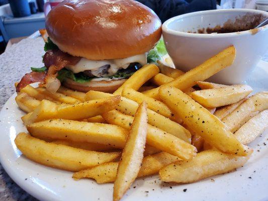 Bacon cheese burger with a side of fries