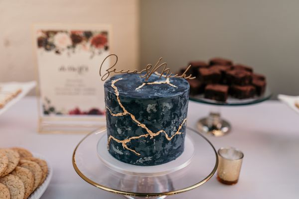 Our beautiful wedding cake! The inside is yellow cake with chocolate buttercream filling (delicious).